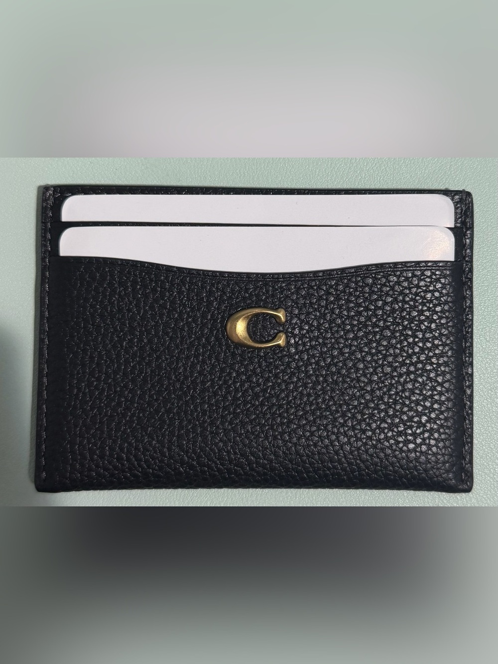 Coach Black Pebbled Leather Card Sleeve with Brass C Charm